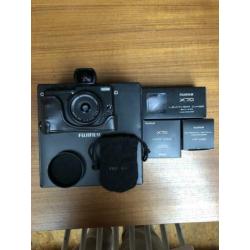 Fuji X70 camera met accessoires
