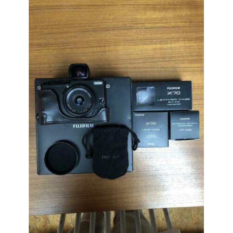 Fuji X70 camera met accessoires
