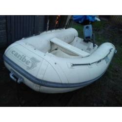Caribe rib rubberboot, polyester bodem, met een 4pk evinrude
