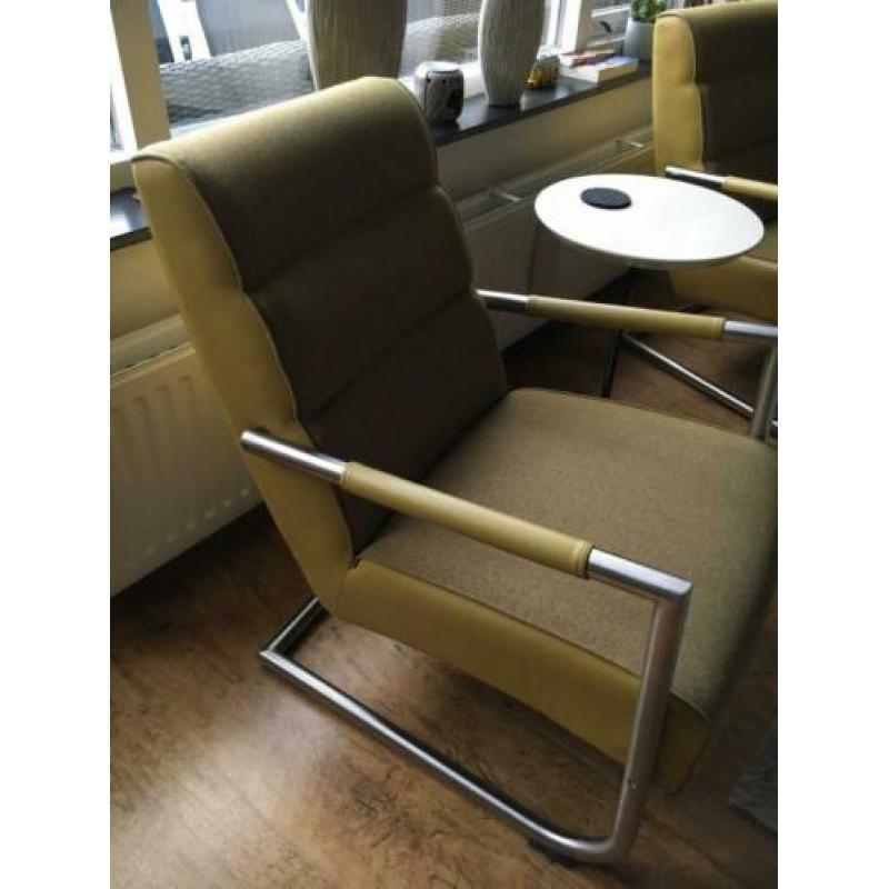 Twee fauteuils, en Hocker