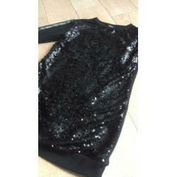 Gave sweatstof jurk met voorkant van pailletten maat 146/152