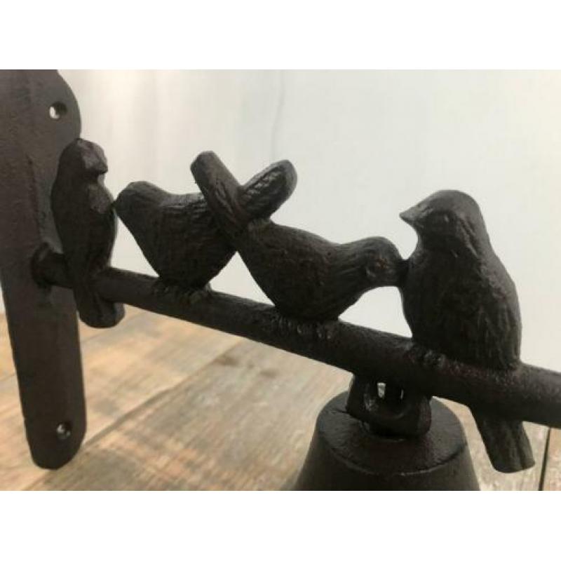 Bel, stok met vogels erop, gietijzer